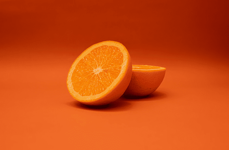 slices of oranges on an orange background