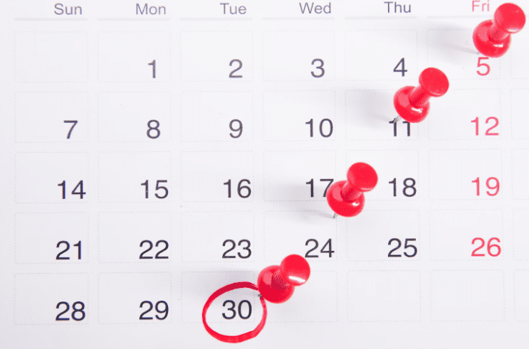 red pins on a calendar