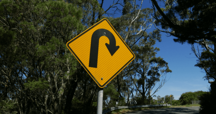 u-turn sign on a road