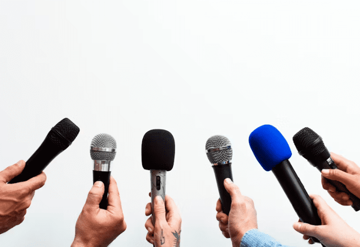 different mics being held by hands